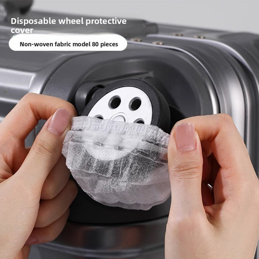 Disposable luggage wheel covers