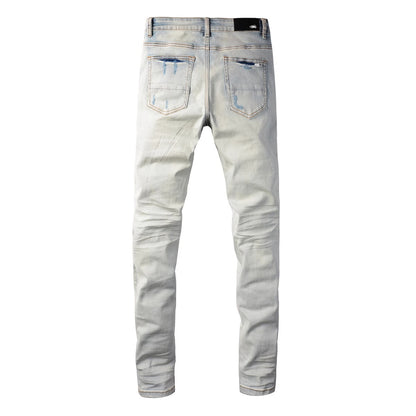 Distressed red patched jeans