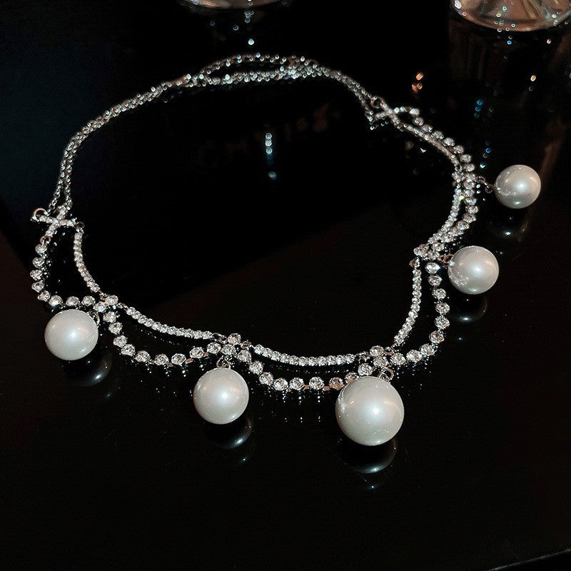 Exquisite diamond-set drop pearl necklace