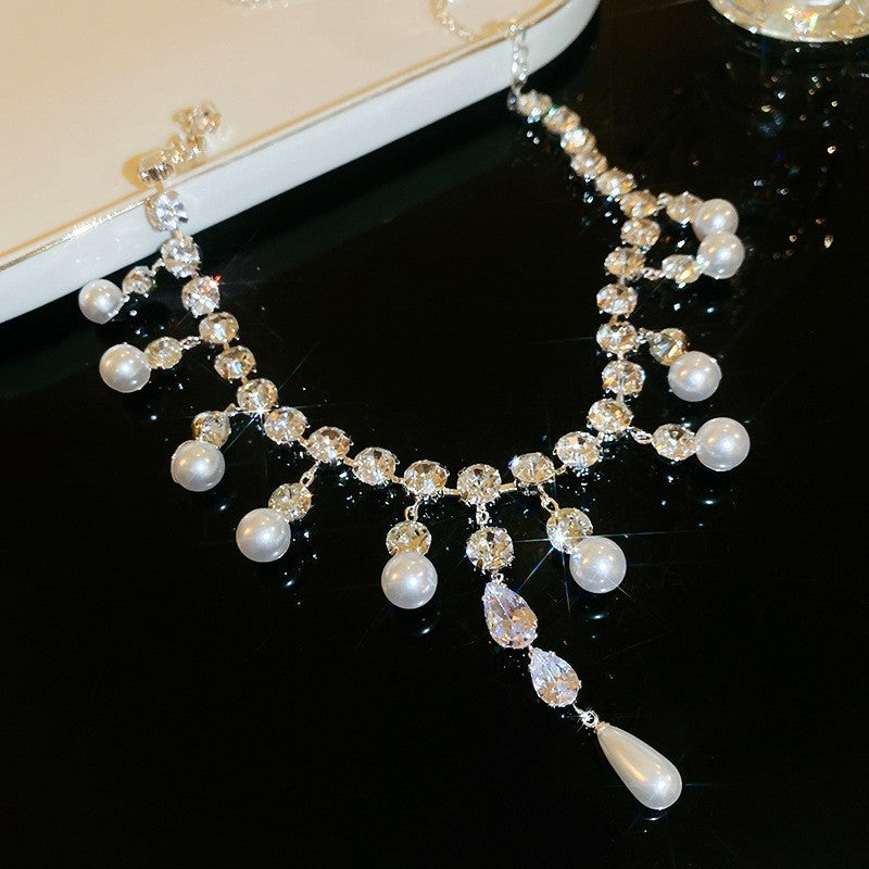 Exquisite diamond-set drop pearl necklace