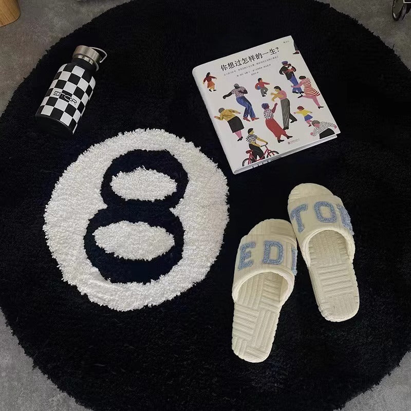 Flocked round black 8-digit carpet