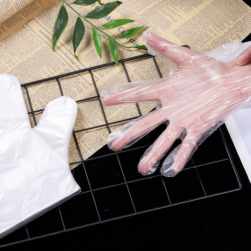 Food grade disposable gloves wholesale thickened disposable film gloves catering beauty takeaway plastic gloves
