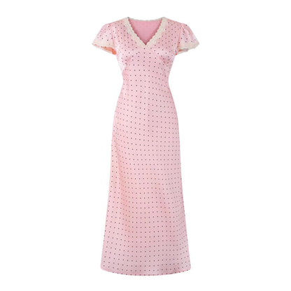 French-style tea party dress in pink with a V-neck, puff sleeves, and polka dots