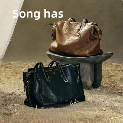 Gender-neutral vegetable-tanned leather crossbody bag