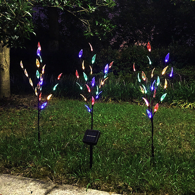 Ground-mounted tree branch lamp