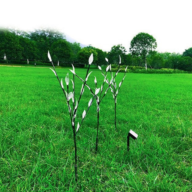 Ground-mounted tree branch lamp