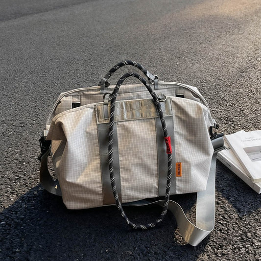 Handheld crossbody travel bag