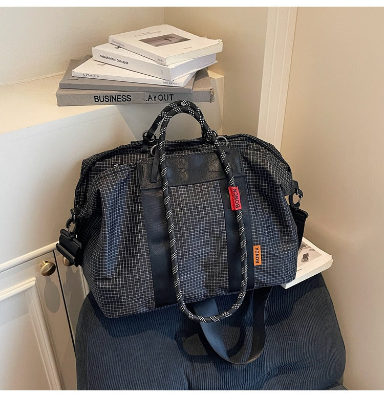 Handheld crossbody travel bag