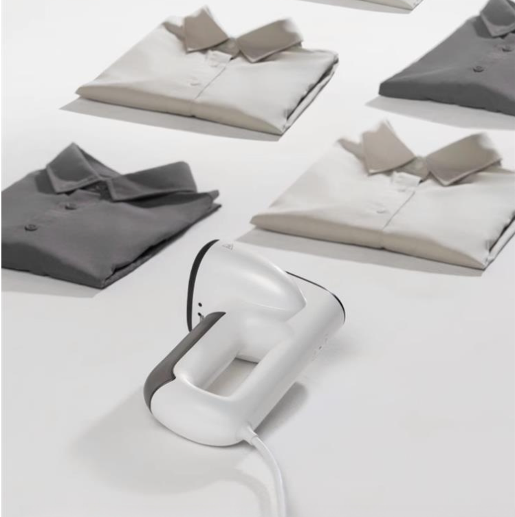 Handheld ironing machine