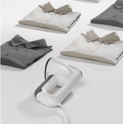 Handheld ironing machine