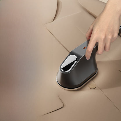 Handheld steam ironing machine