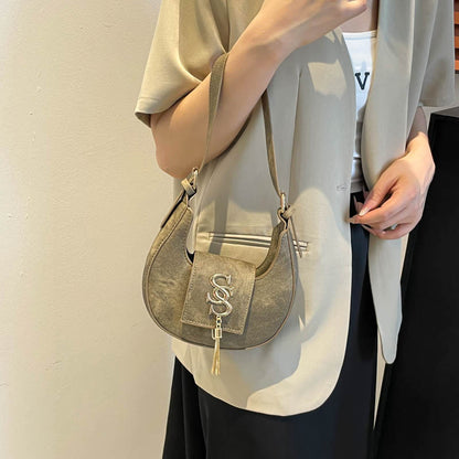 Hardware fringed crescent bag