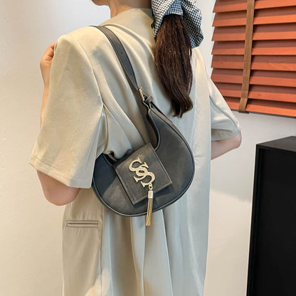Hardware fringed crescent bag