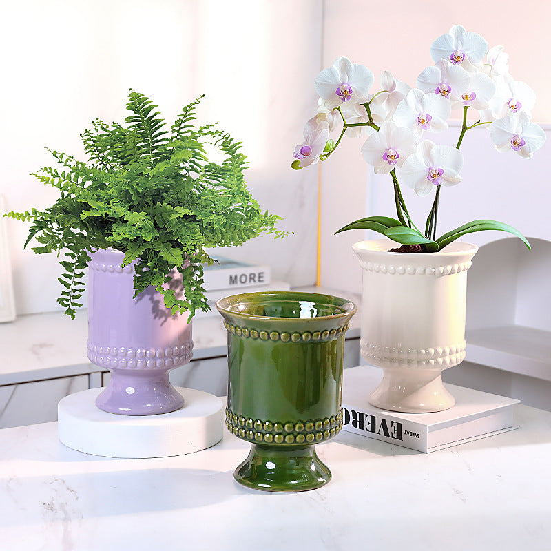 High-legged ceramic perforated flowerpot