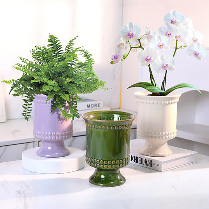High-legged ceramic perforated flowerpot