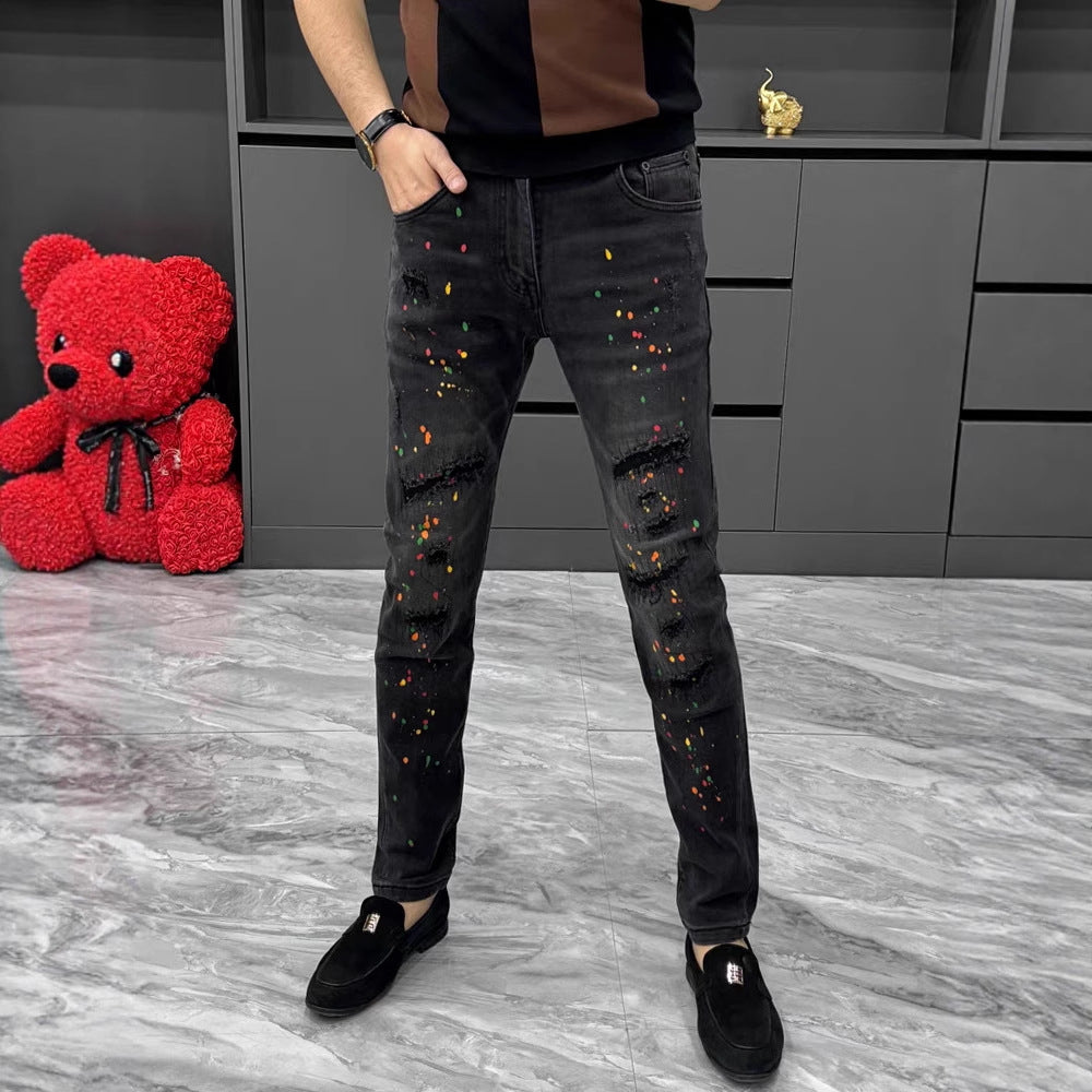 Hipster-style distressed ink-stained jeans