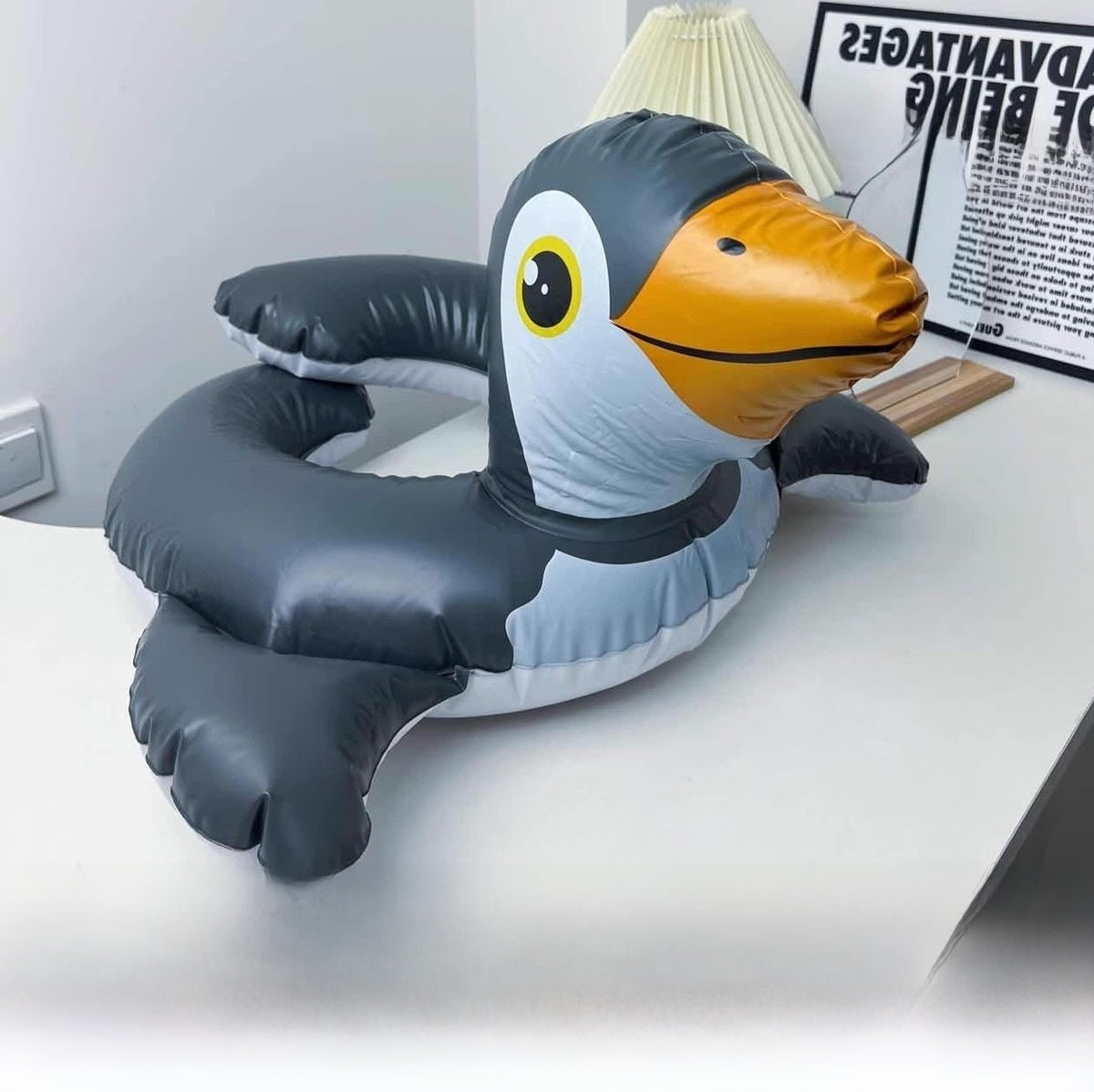 Inflatable swimming ring