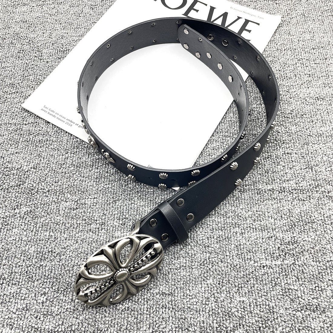 Inlaid rivet belt