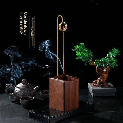 Inverted incense stick with sandalwood thread
