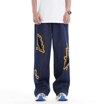 Jeans with hole patches and embroidery