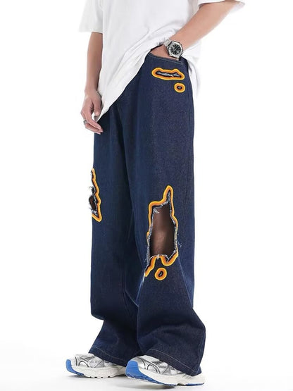 Jeans with hole patches and embroidery