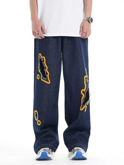 Jeans with hole patches and embroidery
