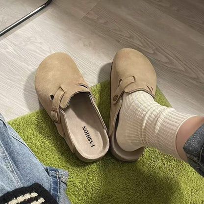 Ladies wear flip-flops with their heads covered