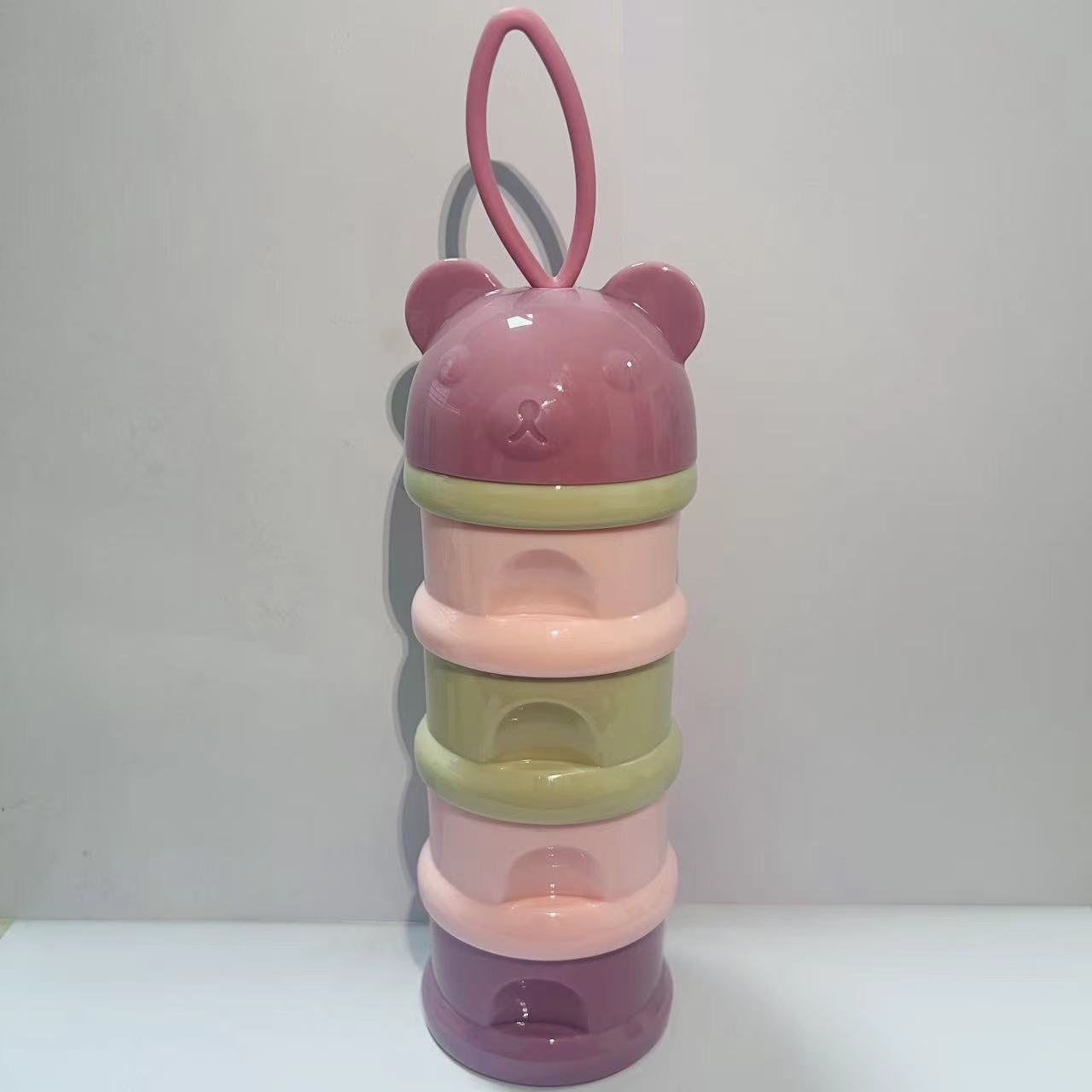 Layered milk powder compartment