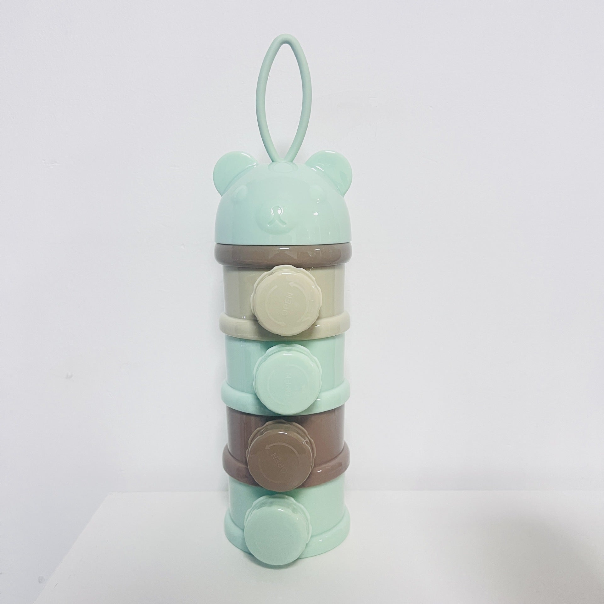 Layered milk powder compartment
