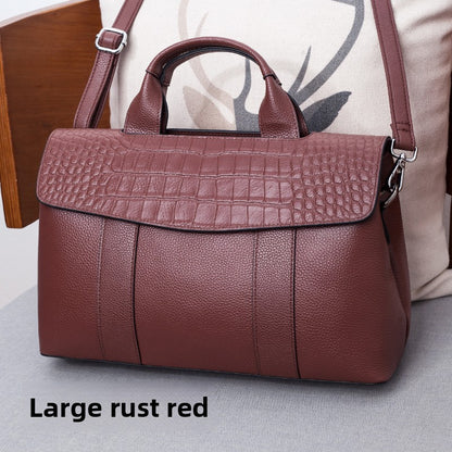 Leather handbag with a crossbody strap