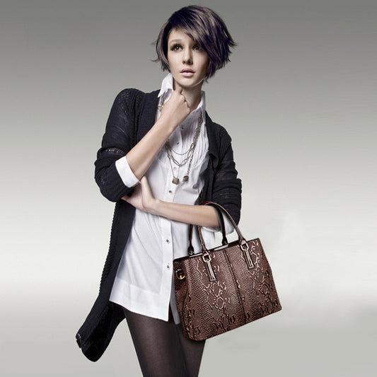 Leather snake-pattern handbag