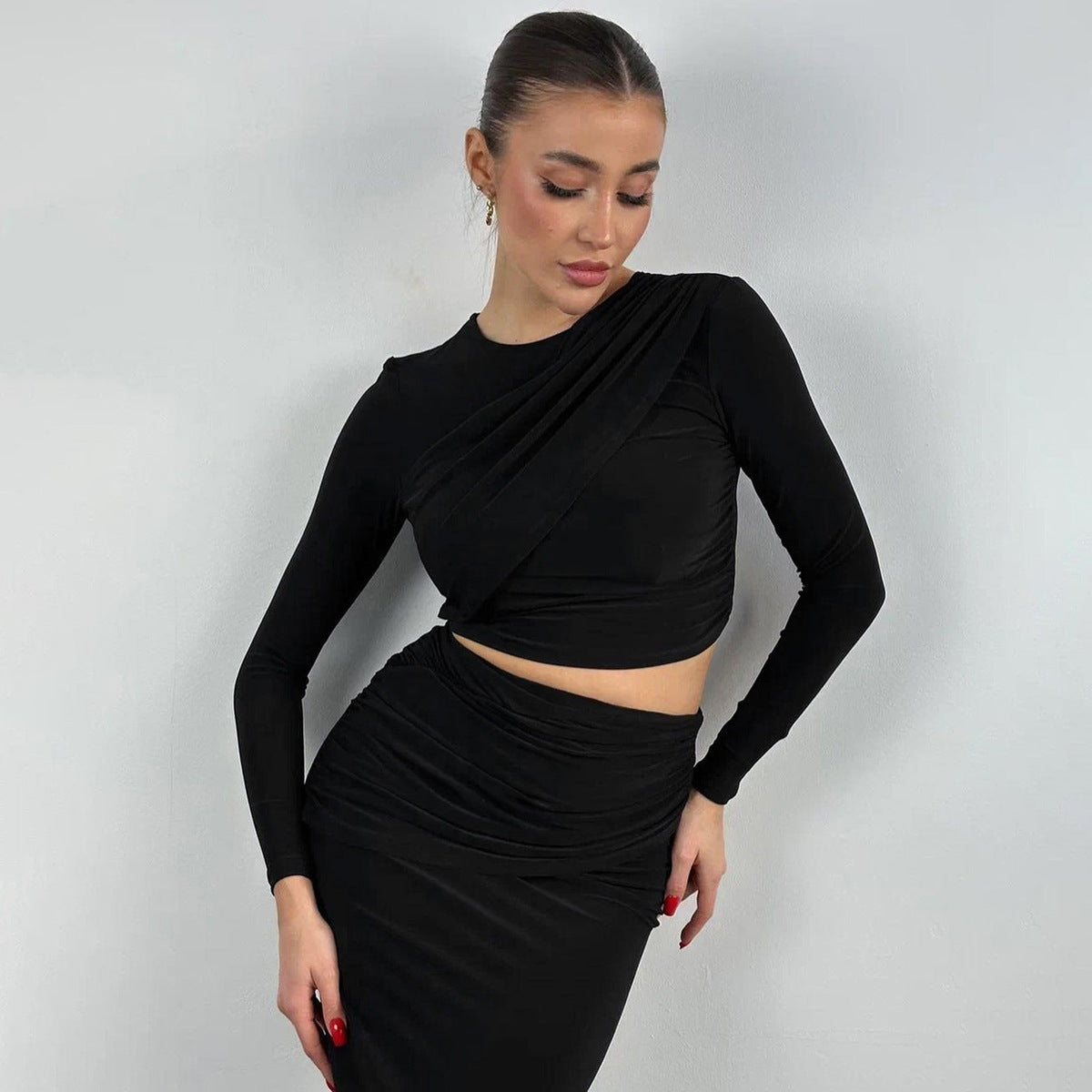 Long-sleeved crop top and half-length skirt