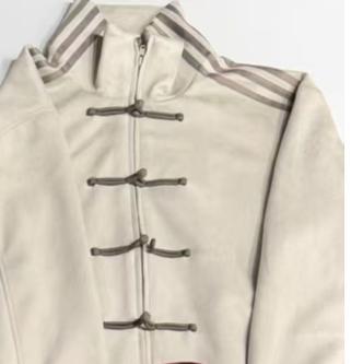 Loose jacket with stand-up collar and buckles
