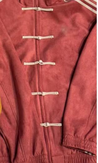 Loose jacket with stand-up collar and buckles