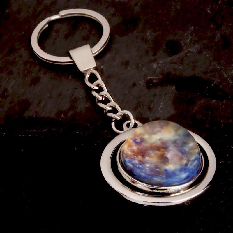 Luminous Celestial Keychain Pendant with Rotating Design