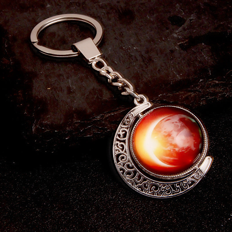 Luminous Celestial Keychain Pendant with Rotating Design