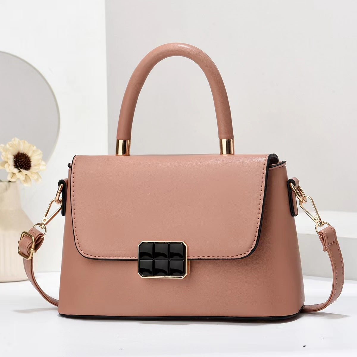 Macaron-colored handbag with a shoulder strap