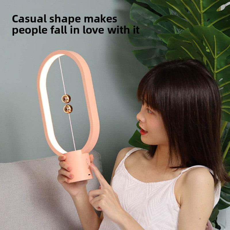 Magnetic suspension and balance lamp