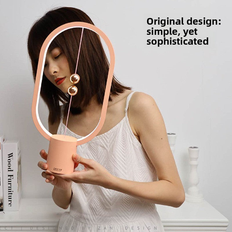 Magnetic suspension and balance lamp