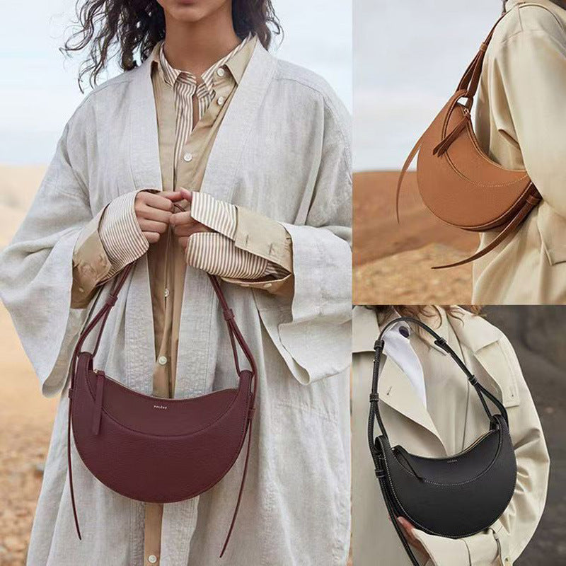 Moon-shaped bag with horseback-style shoulder strap