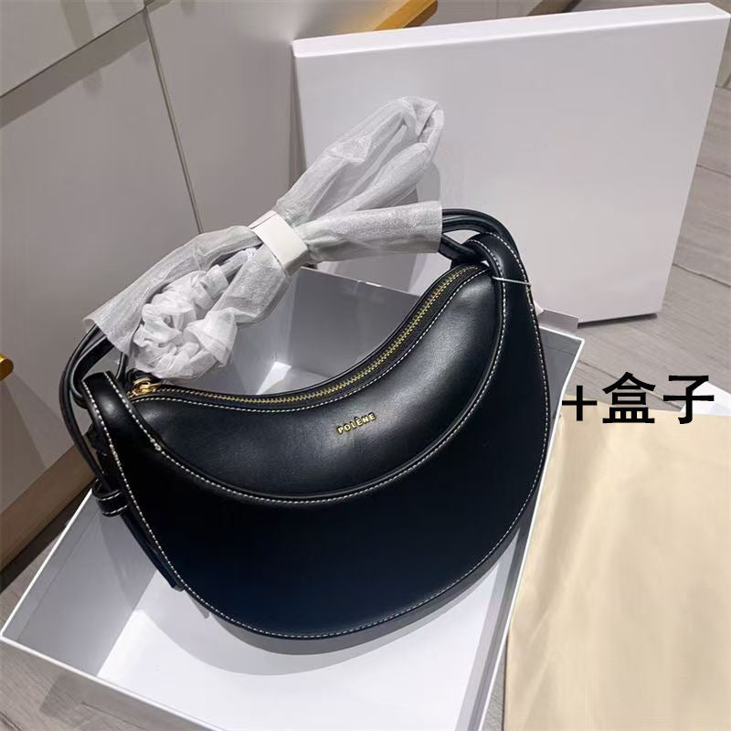 Moon-shaped bag with horseback-style shoulder strap