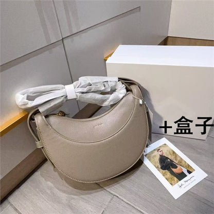 Moon-shaped bag with horseback-style shoulder strap