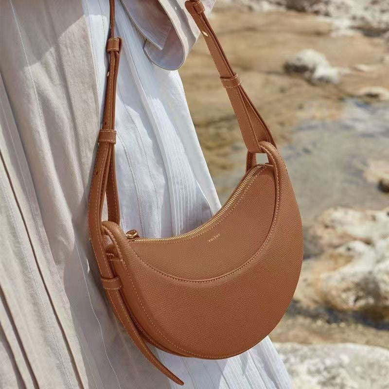 Moon-shaped bag with horseback-style shoulder strap