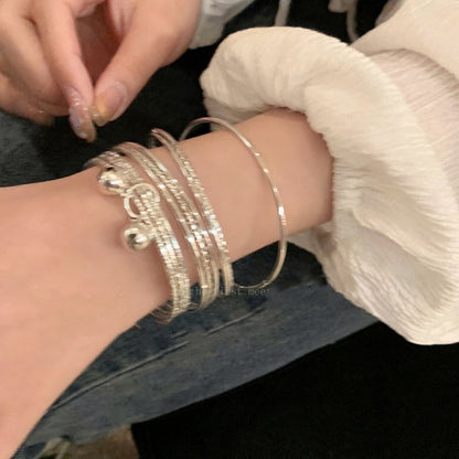 Multi-Loop Bell Pendant Bracelet