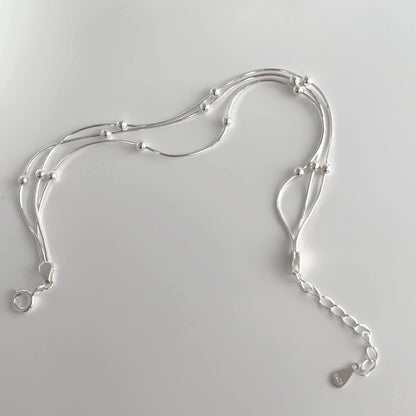 Multiple-layered hand jewelry worn by women