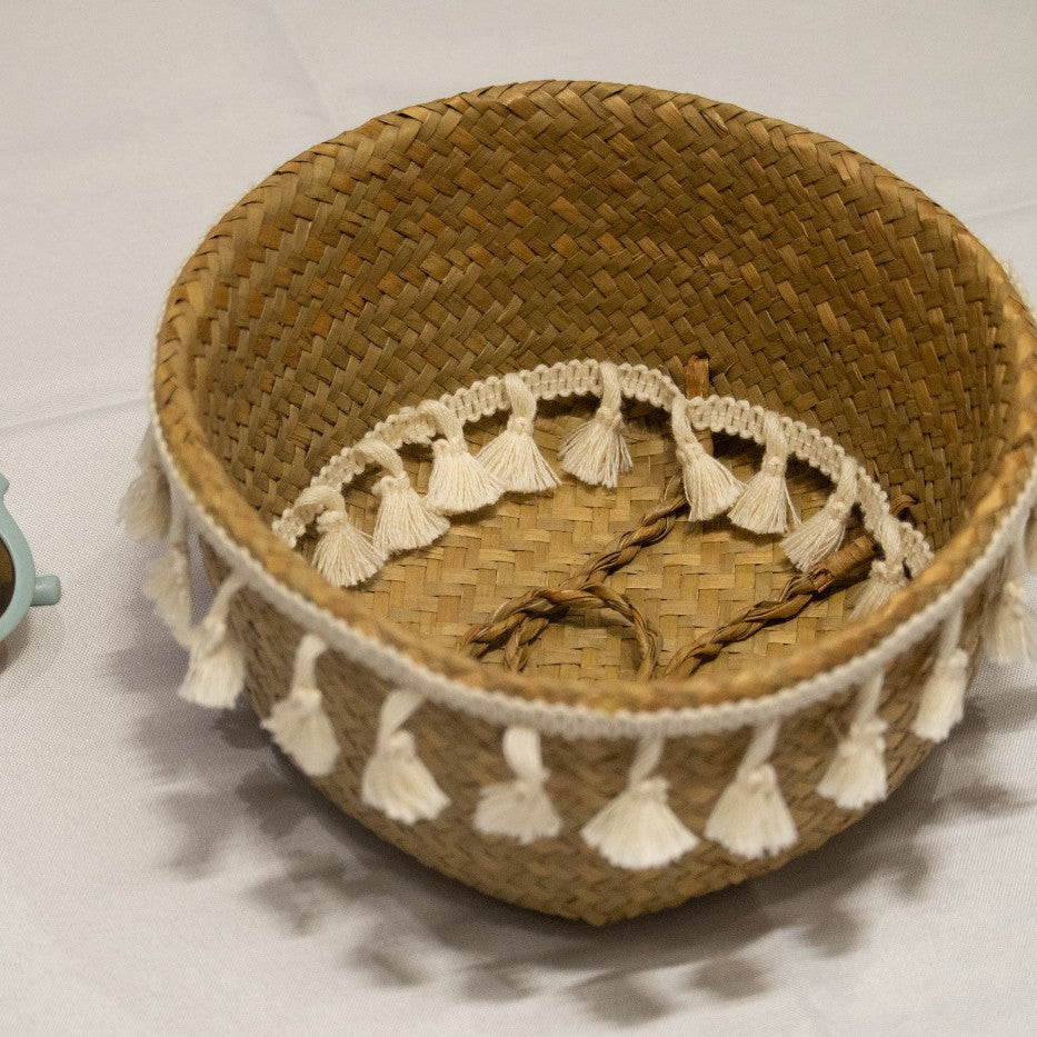 Nordic-style woven fringed seagrass basket