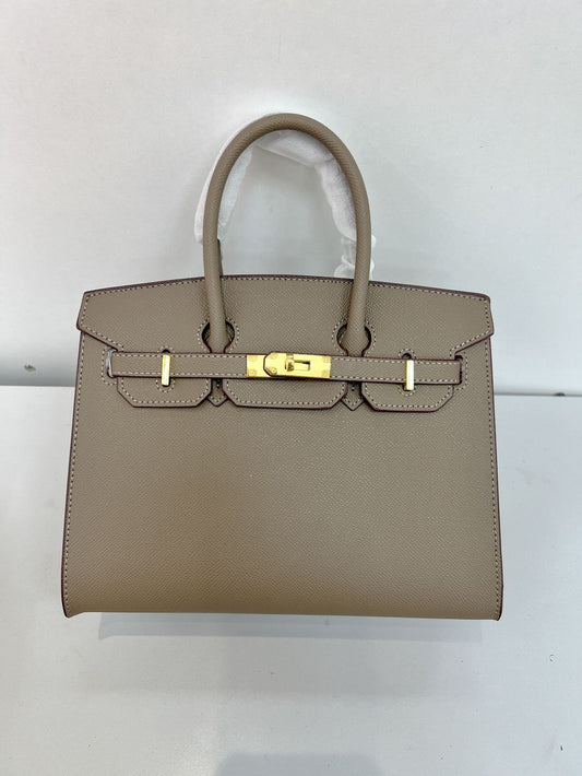 Outer sewn commuter single-shoulder handbag