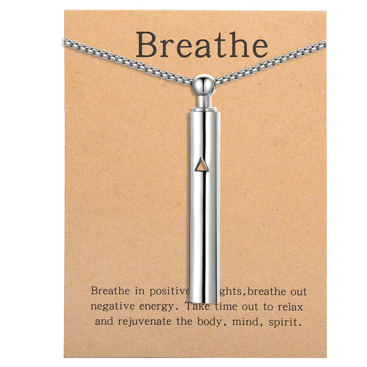 Pendant necklace with titanium and steel whistle