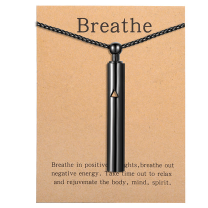Pendant necklace with titanium and steel whistle