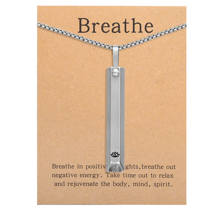 Pendant necklace with titanium and steel whistle